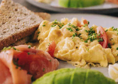 Scrambled eggs with smoked salmon, avocado and toast at Ocean Freaks Café in Las Américas