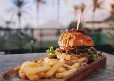 Smash burger and fries at sunset at Ocean Freaks Café in Las Américas